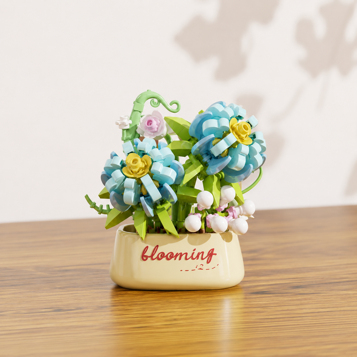 Decorative blue building block flowers in a flower pot on a wooden surface