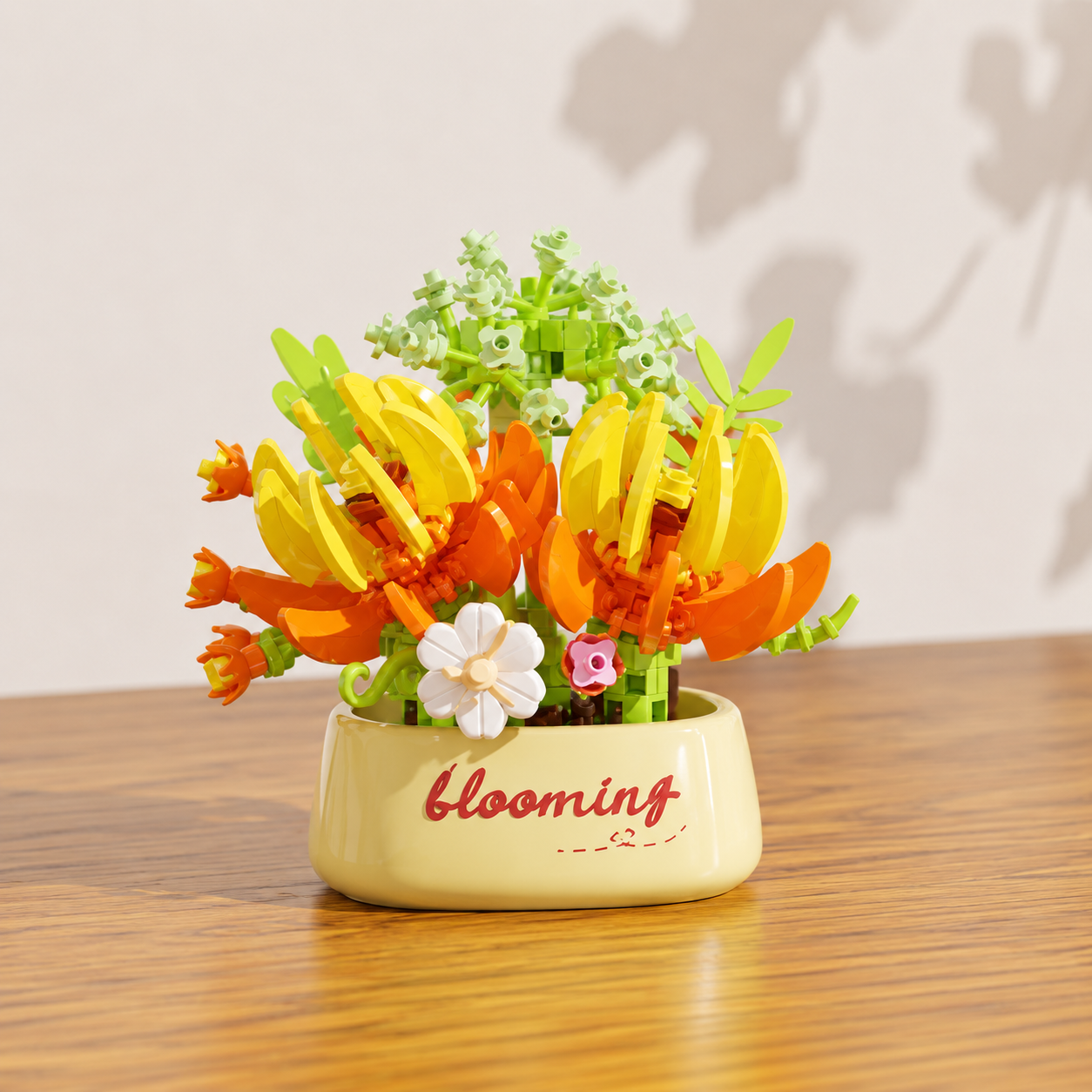 Decorative yellow and orange building block flowers in a flower pot, on a wooden surface