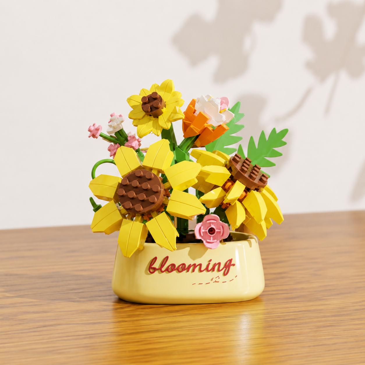 Decorative building block sunflowers in a flower pot on a wooden surface