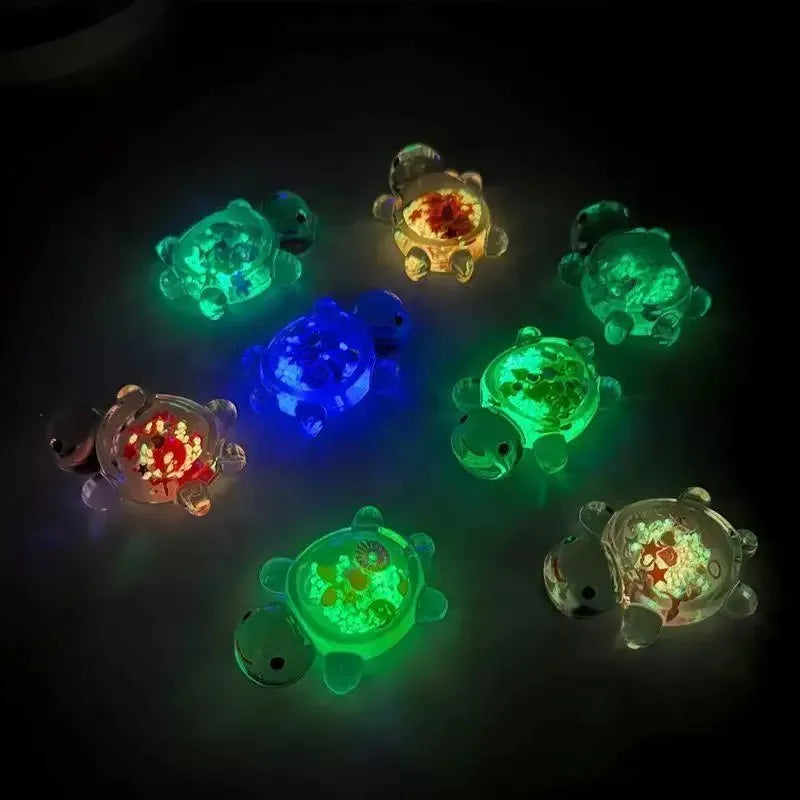 Colorful LED turtle toys on a dark background