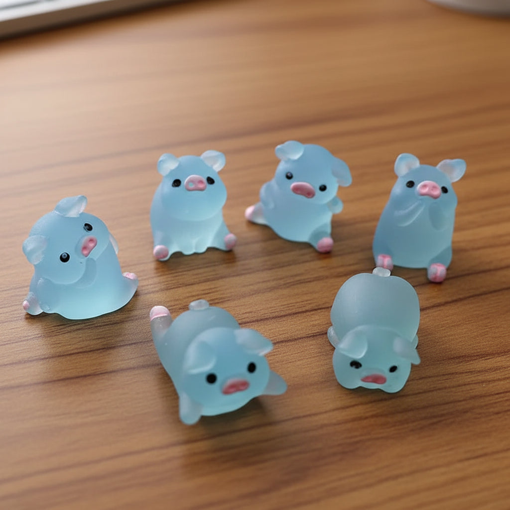 Set of blue cartoonish animal figurines on a table