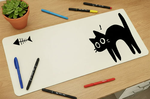 White mouse pad with black cat design on a wooden surface