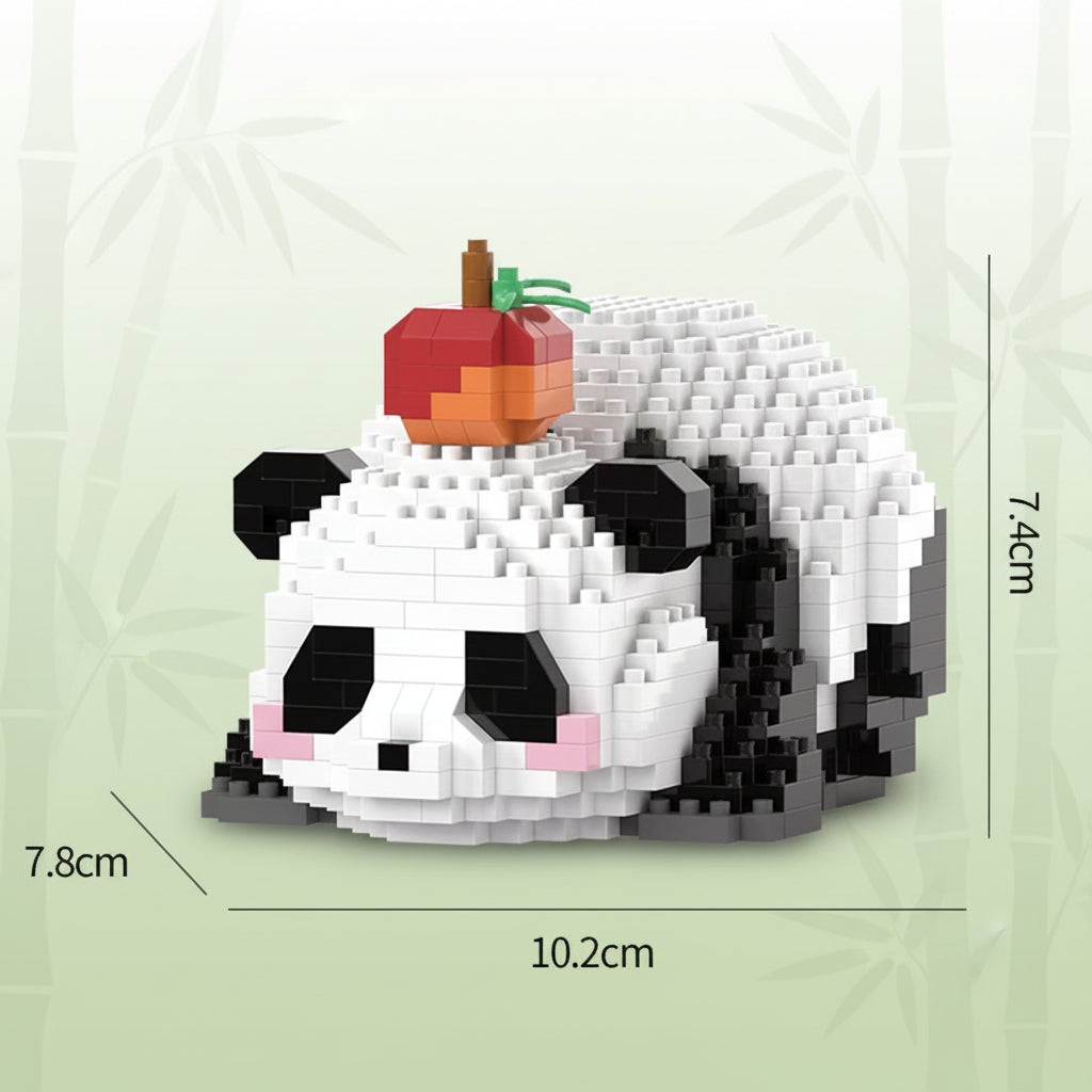 Panda-shaped building block toy with an apple on a white background