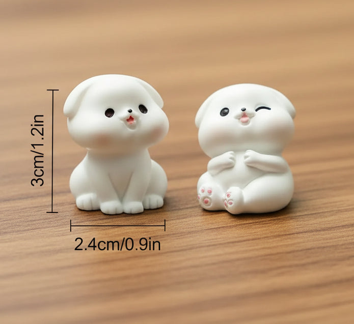 Two small white dog figurines on a textured surface with size measurements displayed.