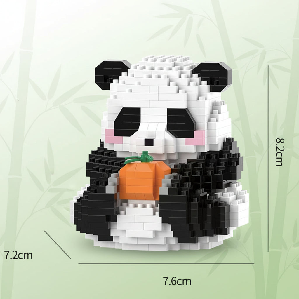 Panda-shaped building block toy with a tangerine, shown with dimensions on a light green background.