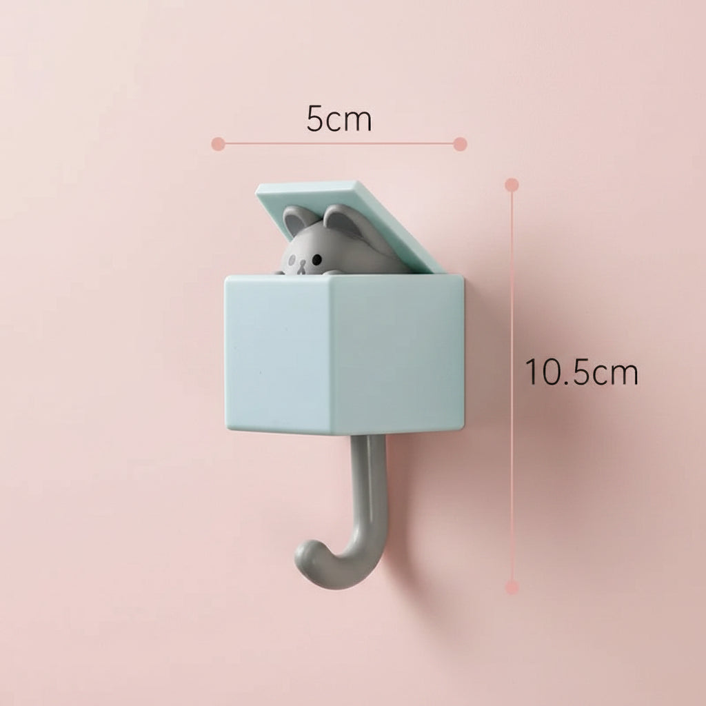 Wall-mounted hook with a small animal figure inside, showing dimensions on a white background.