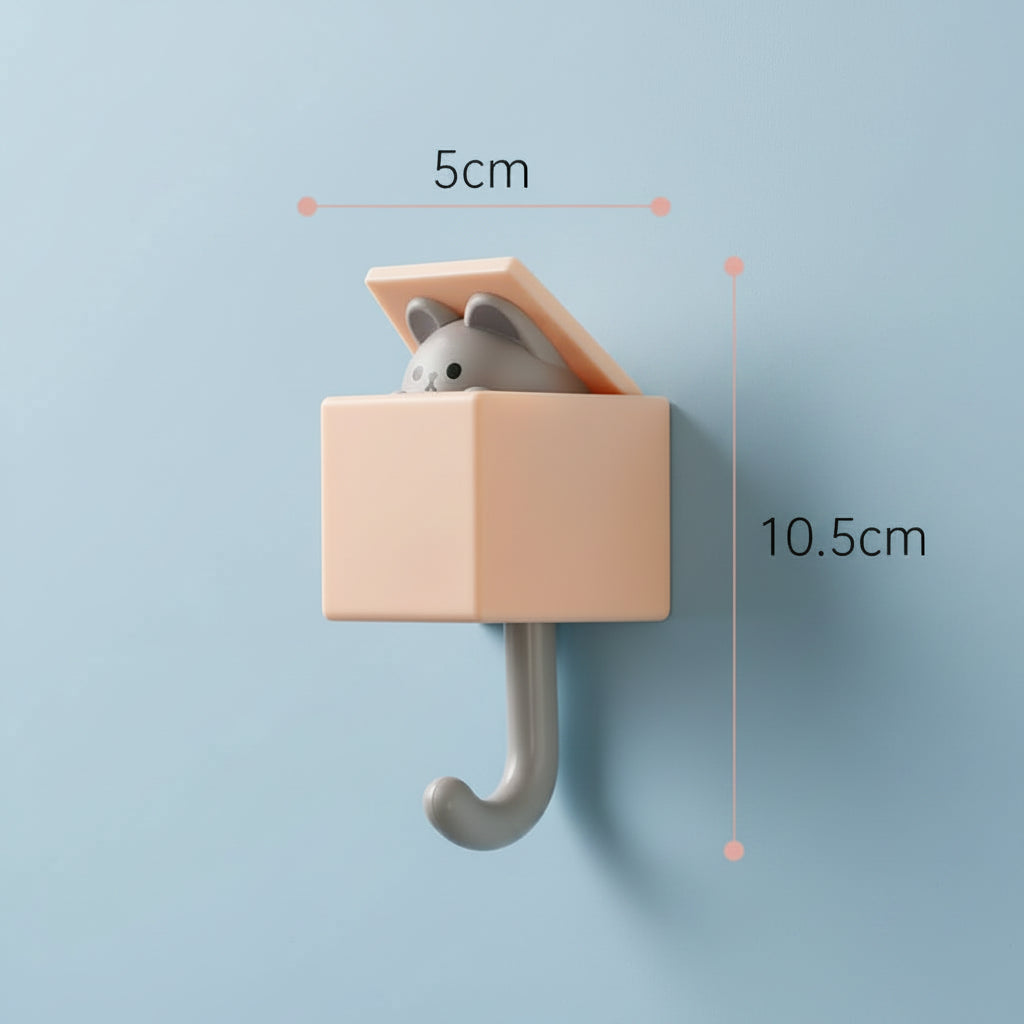 Small pink hook with a gray mouse toy on a light blue background, showing measurements.
