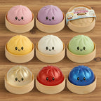 Set of colorful squishy dumplings with smiling faces in wooden steamer baskets on a table