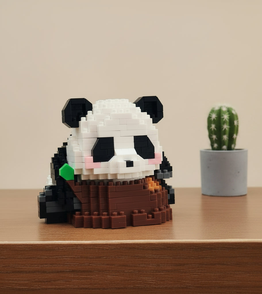 Hand holding a panda-shaped toy made of interlocking bricks