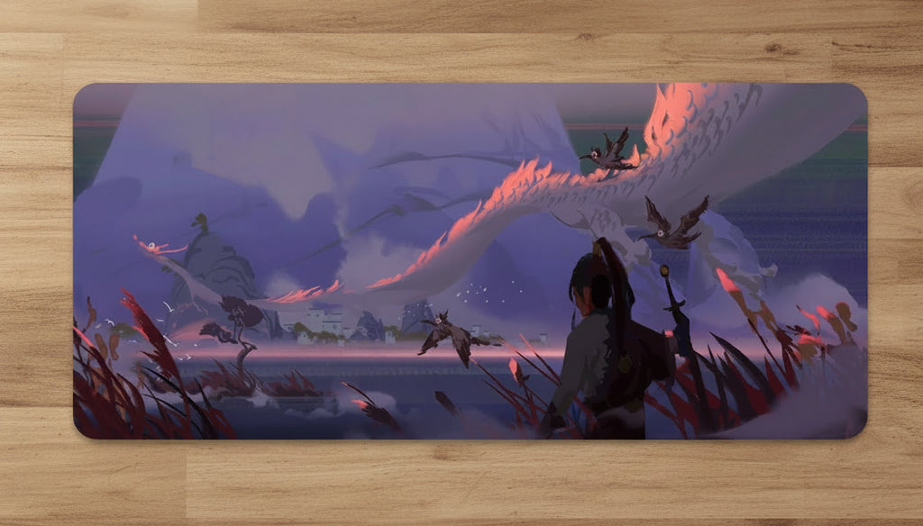 Computer setup with a large desk mat featuring an animated scene
