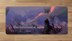 Computer setup with a large desk mat featuring an animated scene