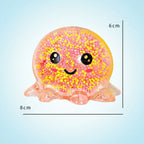 Pink octopus-shaped squishy toy with a smiley face, shown with measurements on a light background.