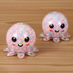 Colorful gelatinous squishy toy with smiling faces on a vibrant background