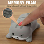 Gray shark-shaped memory foam wrist rest with a hand pressing into it, labeled 'Memory Foam' and 'Slow rebound without deformation'.
