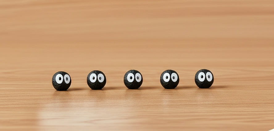 small black characters on a wod table