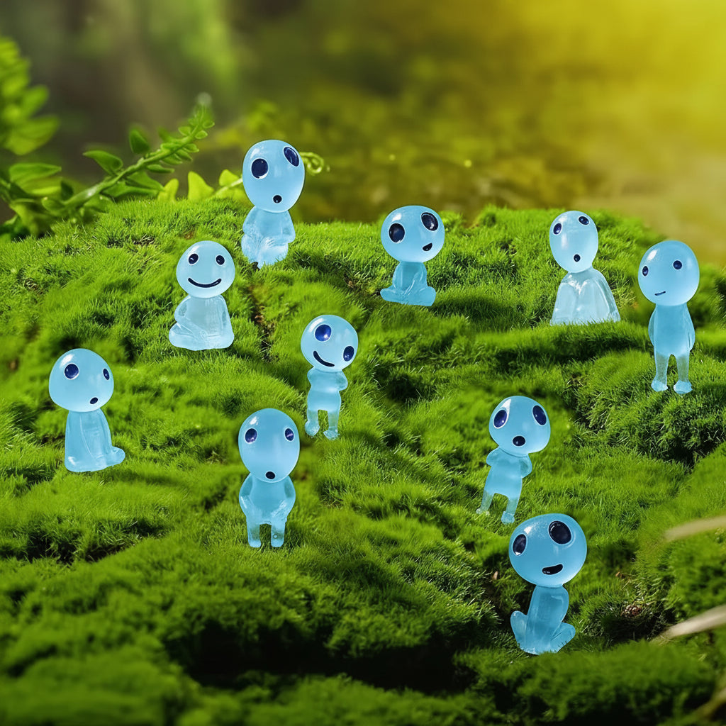 Transparent ghost-like figures with black eyes and green mouths on a grassy surface.