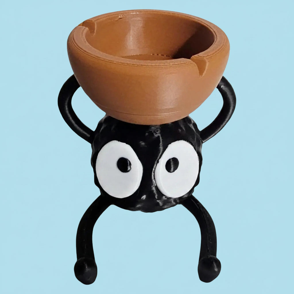 Spider-shaped planter with a brown bowl on a white background