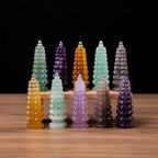 Set of colorful crystal towers on a white surface with a black background