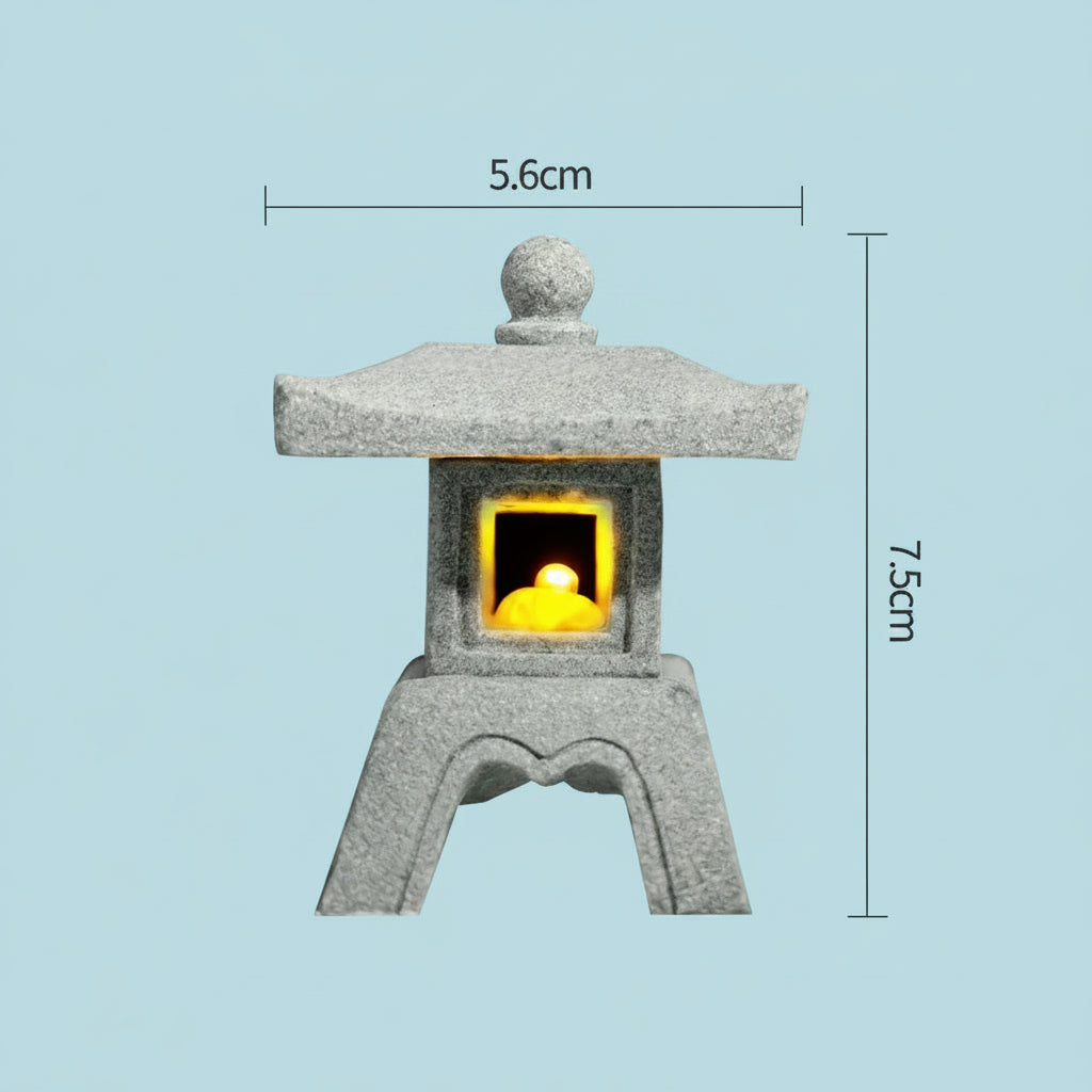 Decorative japanese style Stone lantern with a yellow lit interior, showing dimensions on a light blue background