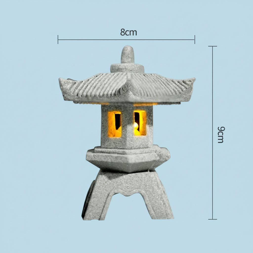 Decorative Japanese style stone lantern with yellow glowing interior, shown with dimensions on a light blue background