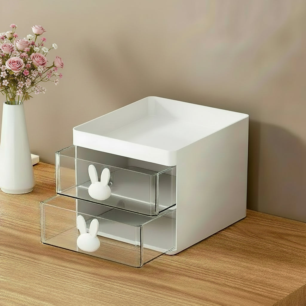 Makeup organizer with brushes, products, and jewelry on a vanity table.