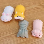 Four cute animal-themed wrist rest on a table