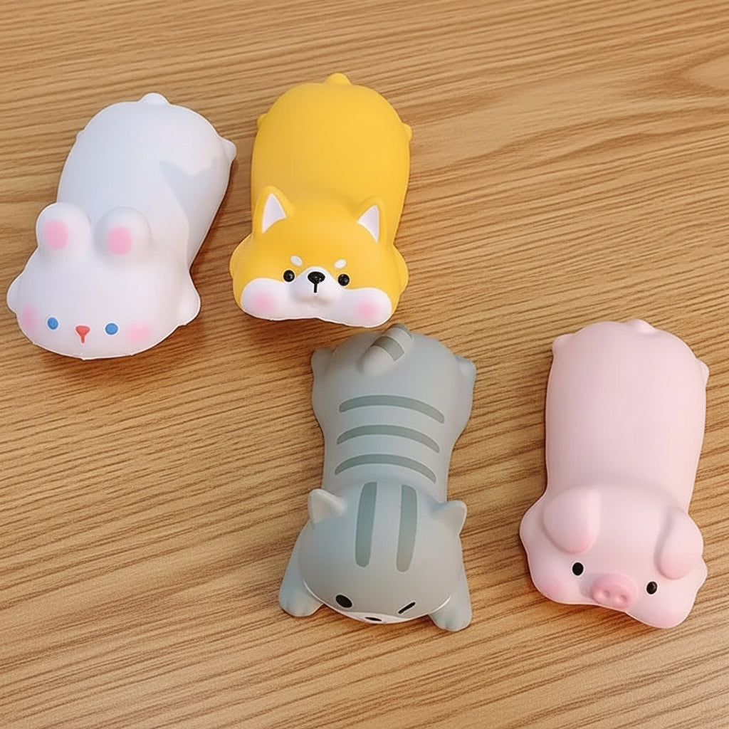 Four cute animal-themed wrist rest on a table