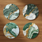 Four circular coasters with green and gold marble pattern on a white background