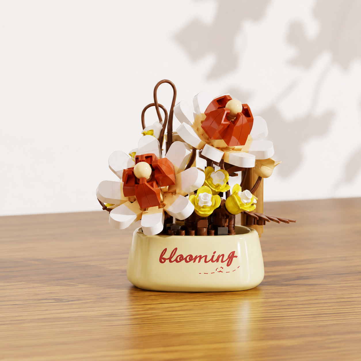 Decorative building brick flowers in a flower pot with a 'blooming' label on a wooden surface